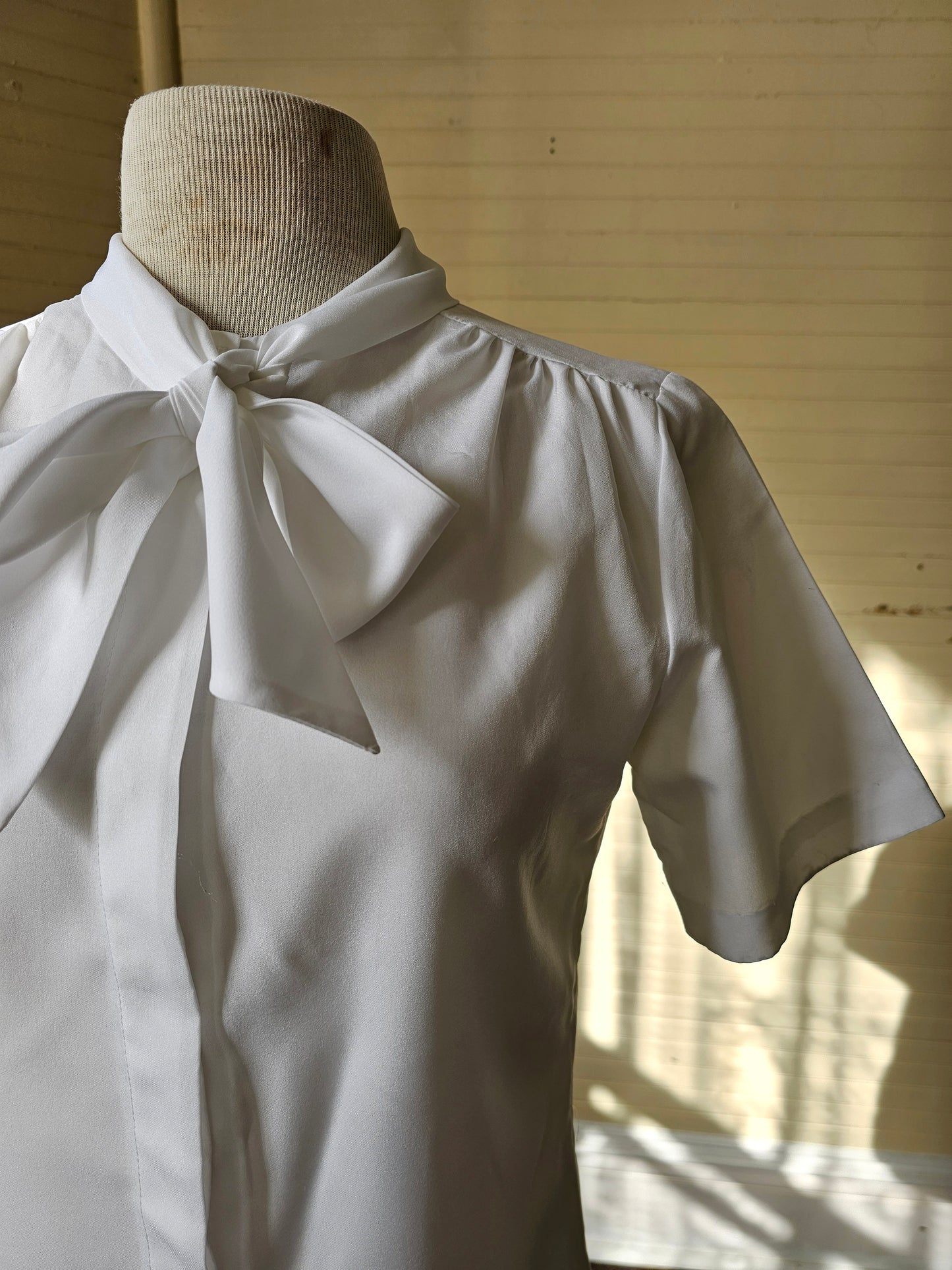 Vintage blouse Paris Station white short sleeves button up front crew neck pussy bow tie rolled collar 70s polyester feminine ladylike granny chic