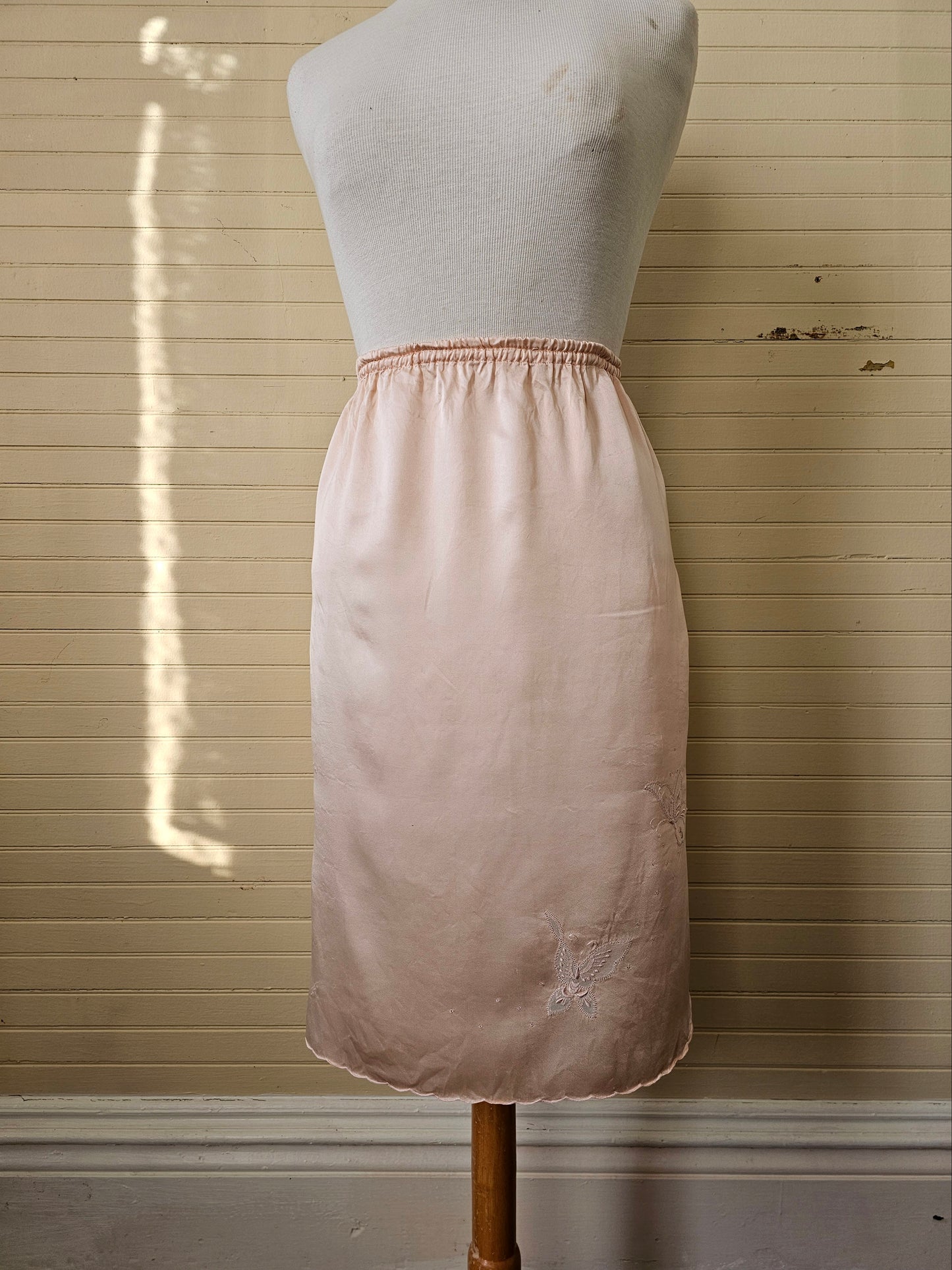 Vintage slip small pink silk half slip skirt lingerie knee length elastic waist thigh leg slit embroidered butterflies scallop edges feminine ladylike romantic