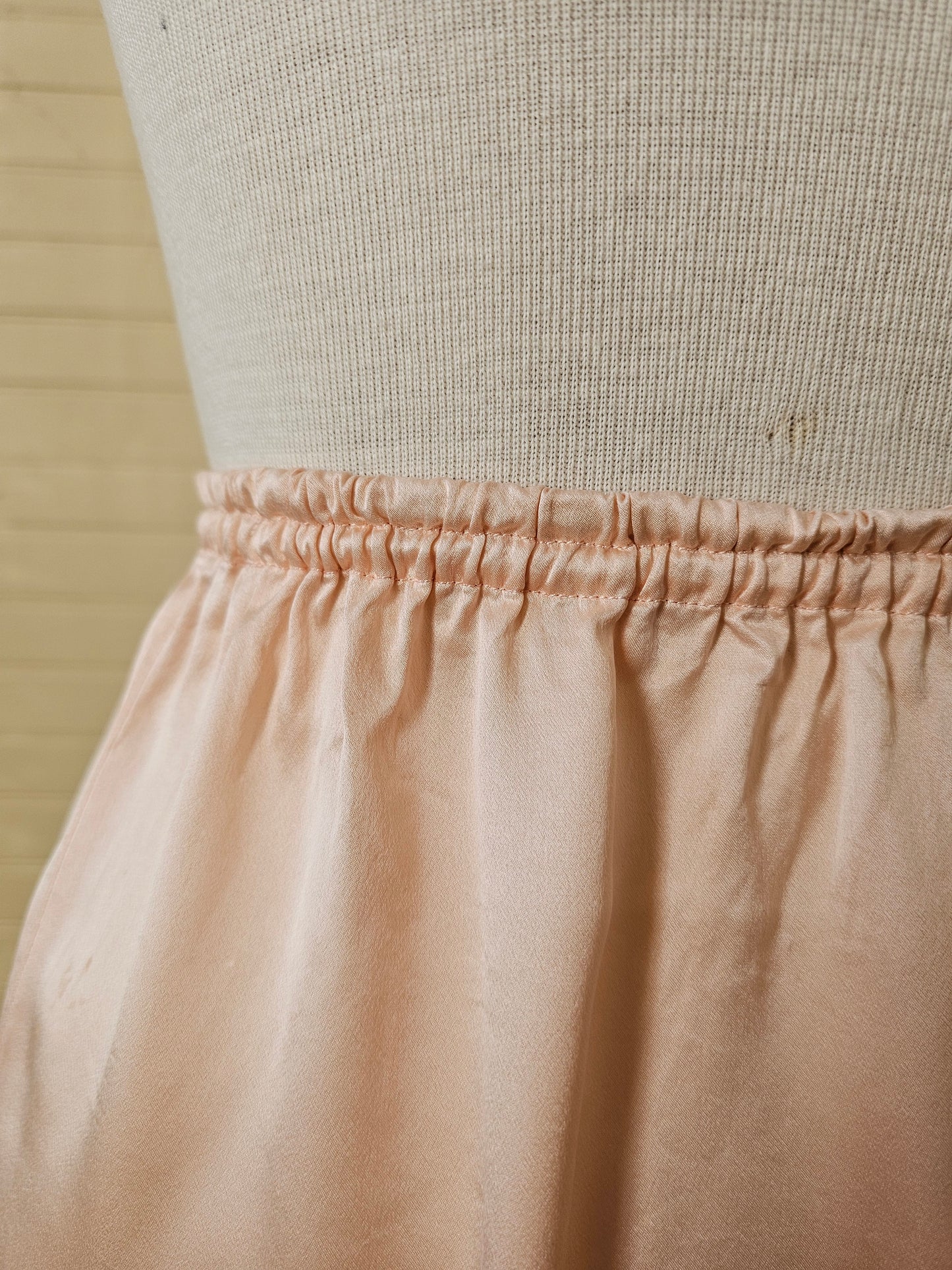 Vintage slip small pink silk half slip skirt lingerie knee length elastic waist thigh leg slit embroidered butterflies scallop edges feminine ladylike romantic