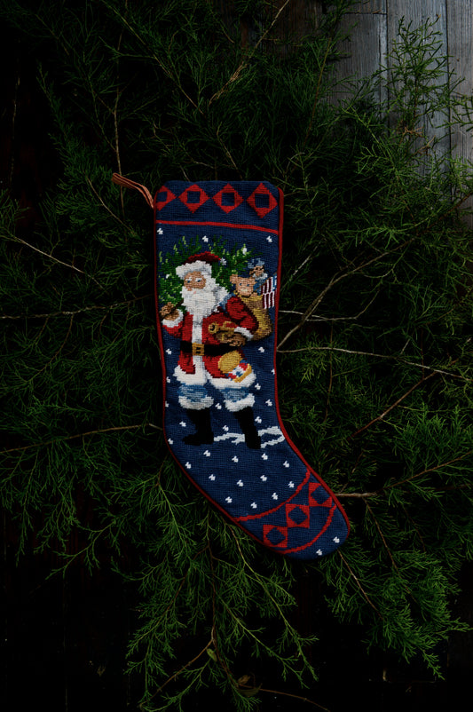 Vintage stocking needlepoint embroidered Santa Claus tree snow gifts navy red green velvet lined looped holiday decor Christmas Victorian cottagecore romantic