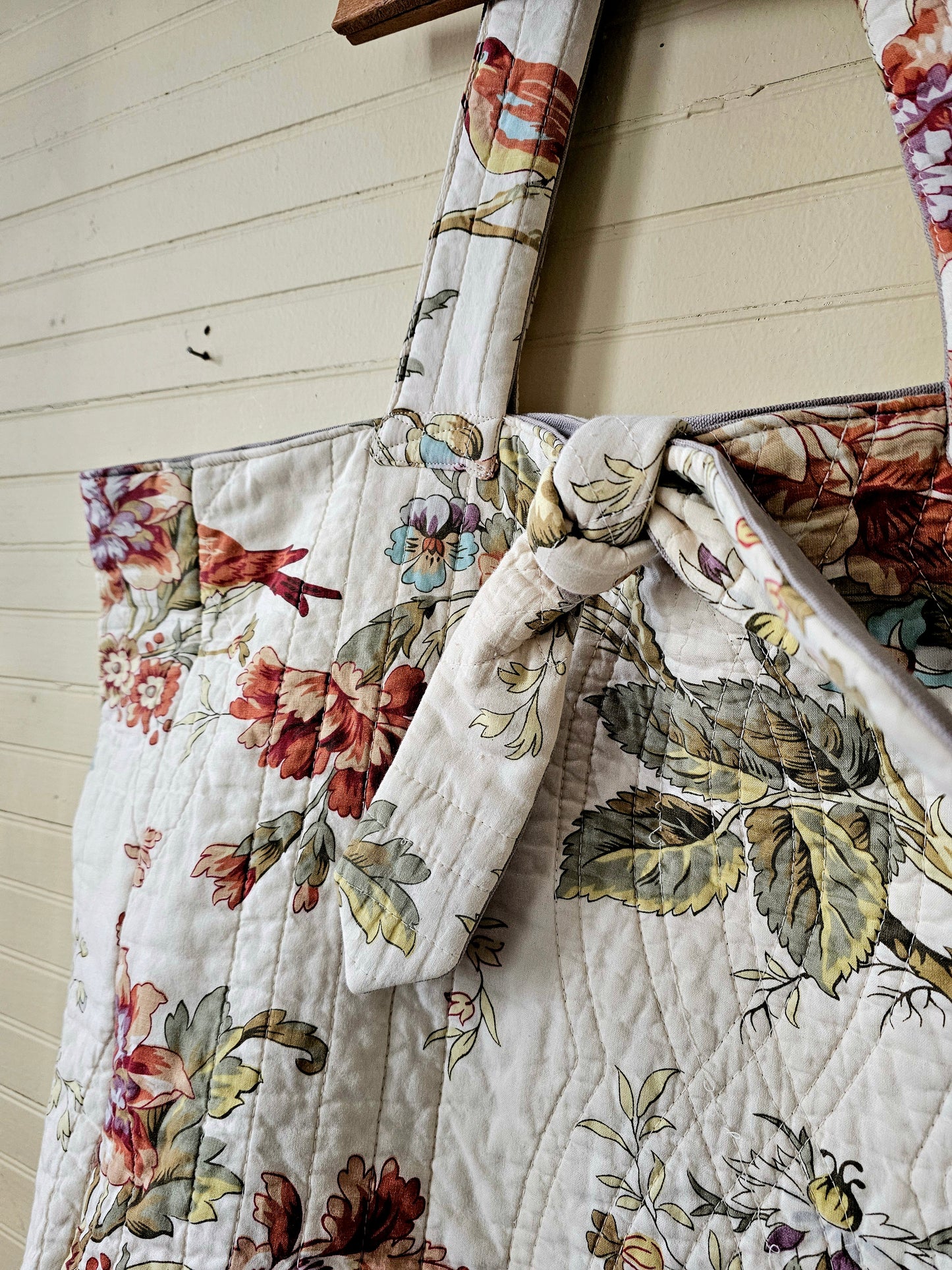Handmade quilt tote, upcycled repurposed large oversized coverlet floral paisley nature bird red brown earth tones tie closure inside pocket