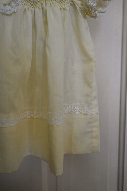 Vintage baby dress, Polly Flanders 3 to 9 mos yellow lace smocked floral button back short sleeves