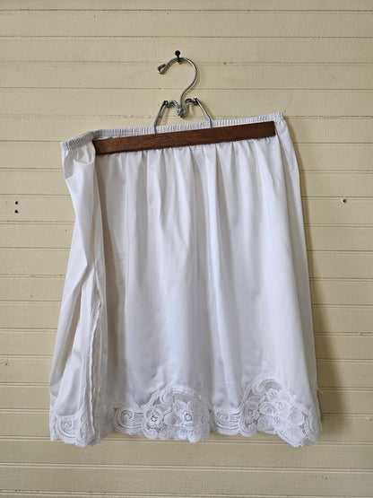 Vintage slip, Vanity Fair 42 large skirt mini short white leg slit lace trim elastic waist 18" long nylon lingerie women intimates half slip